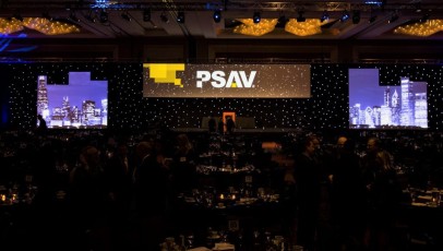 White alternating height AV-Drop Modular Backdrop to create cityscape for front projection at dinner event