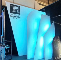 Layered Scenic Flats of AV-Drop Modular Backdrop with angles and curves for trade show