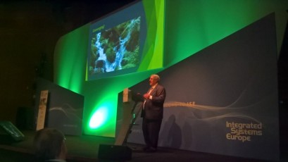 Curved single screen AV-Drop modular backdrop wall with two graphic print angled walls accenting in front on stage for corporate event