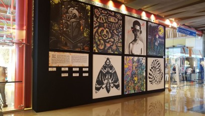 Black AV-Drop Modular Backdrop with art hung on wall for display